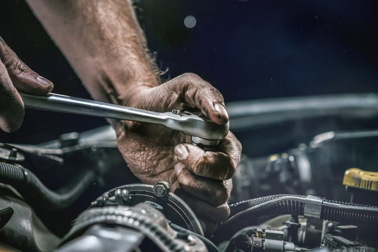 Mechanic working on a car engine