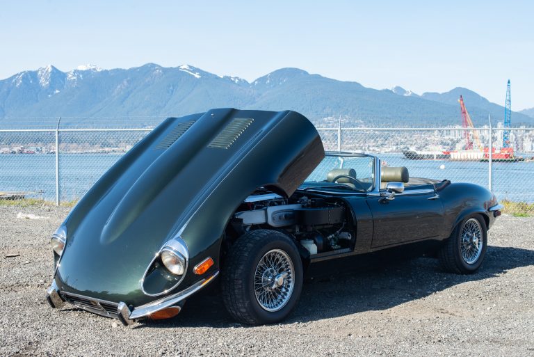 1974 Jaguar E-Type opalescent green hood open 1